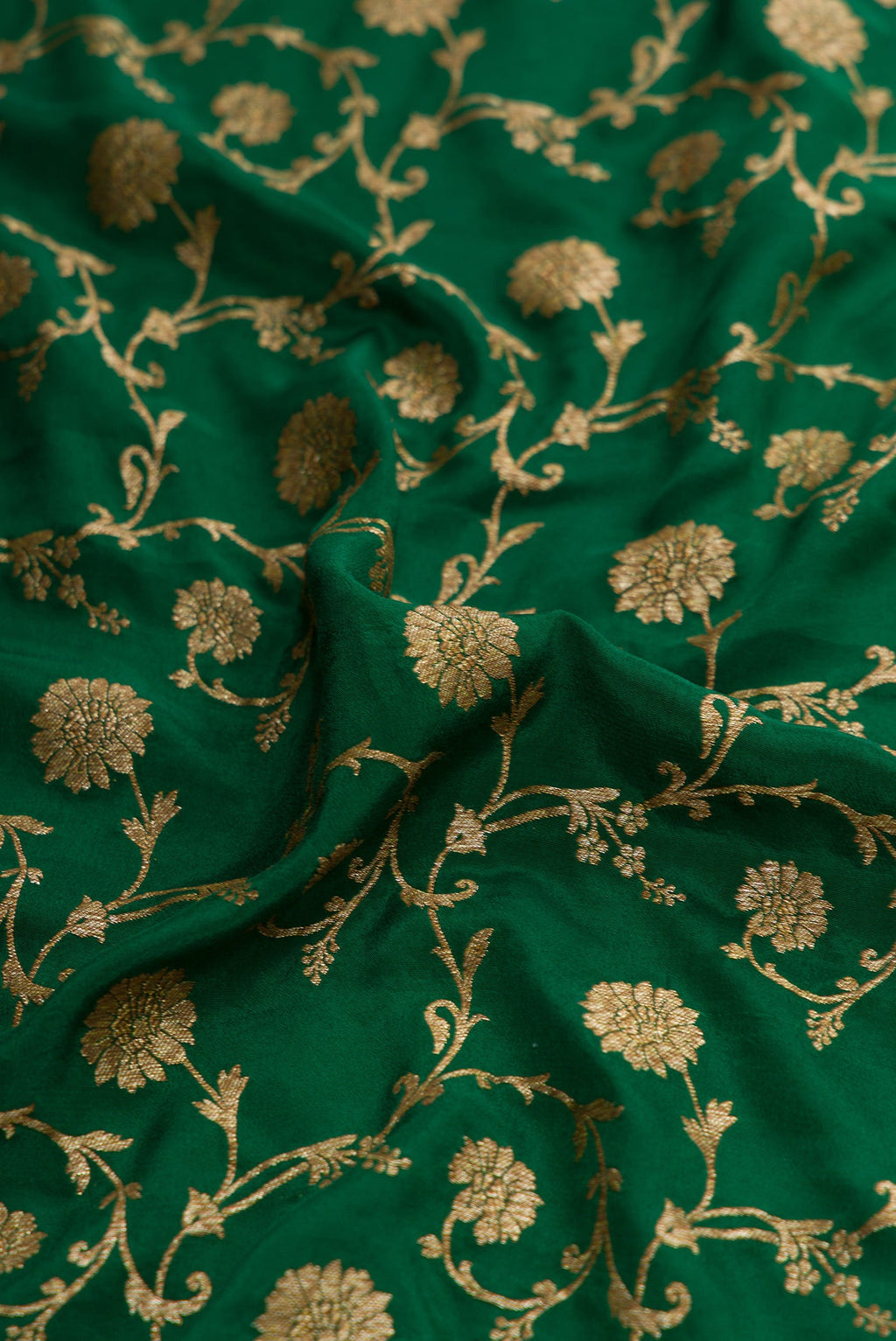Close up of Bottle Green Dual Tone Mysore Georgette Saree with Zari Brocade on the body and Zari Border.  displaying folds