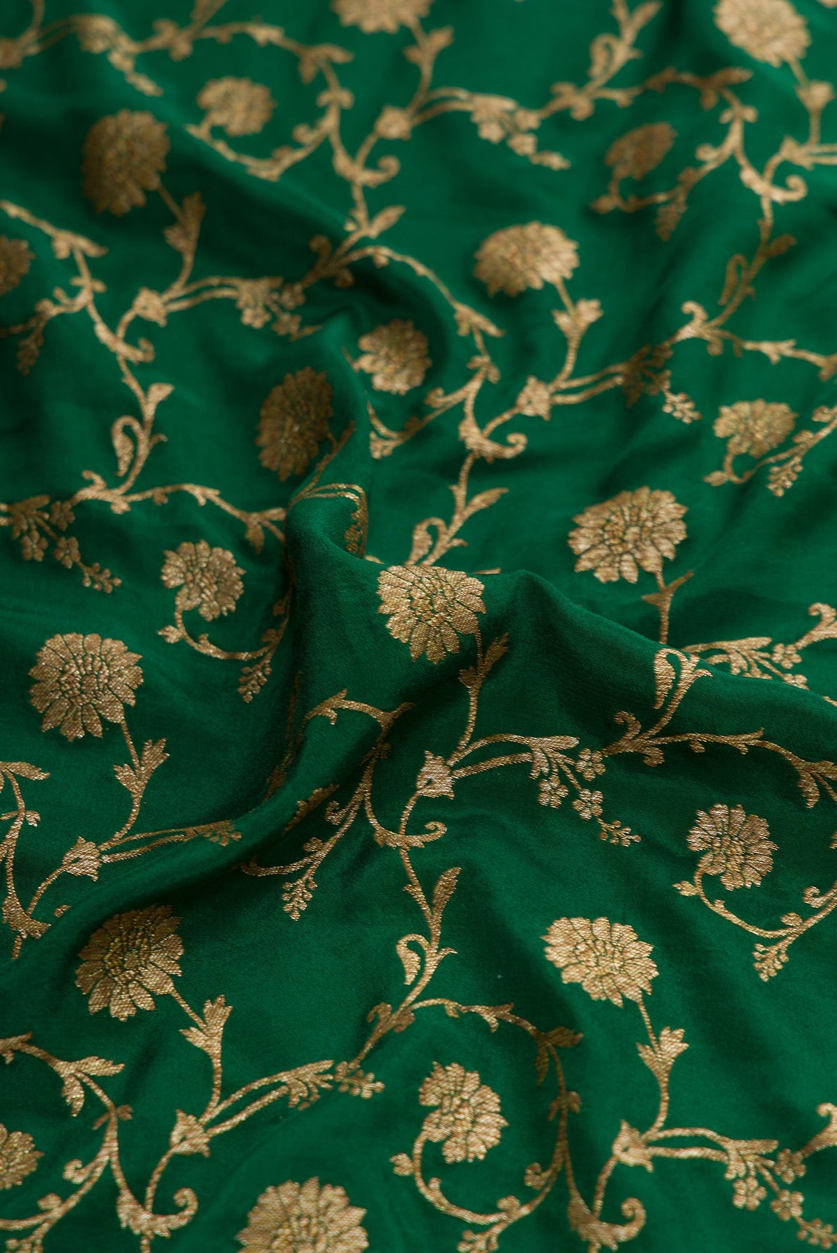 Close up of Bottle Green Dual Tone Mysore Georgette Saree with Zari Brocade on the body and Zari Border.  displaying folds