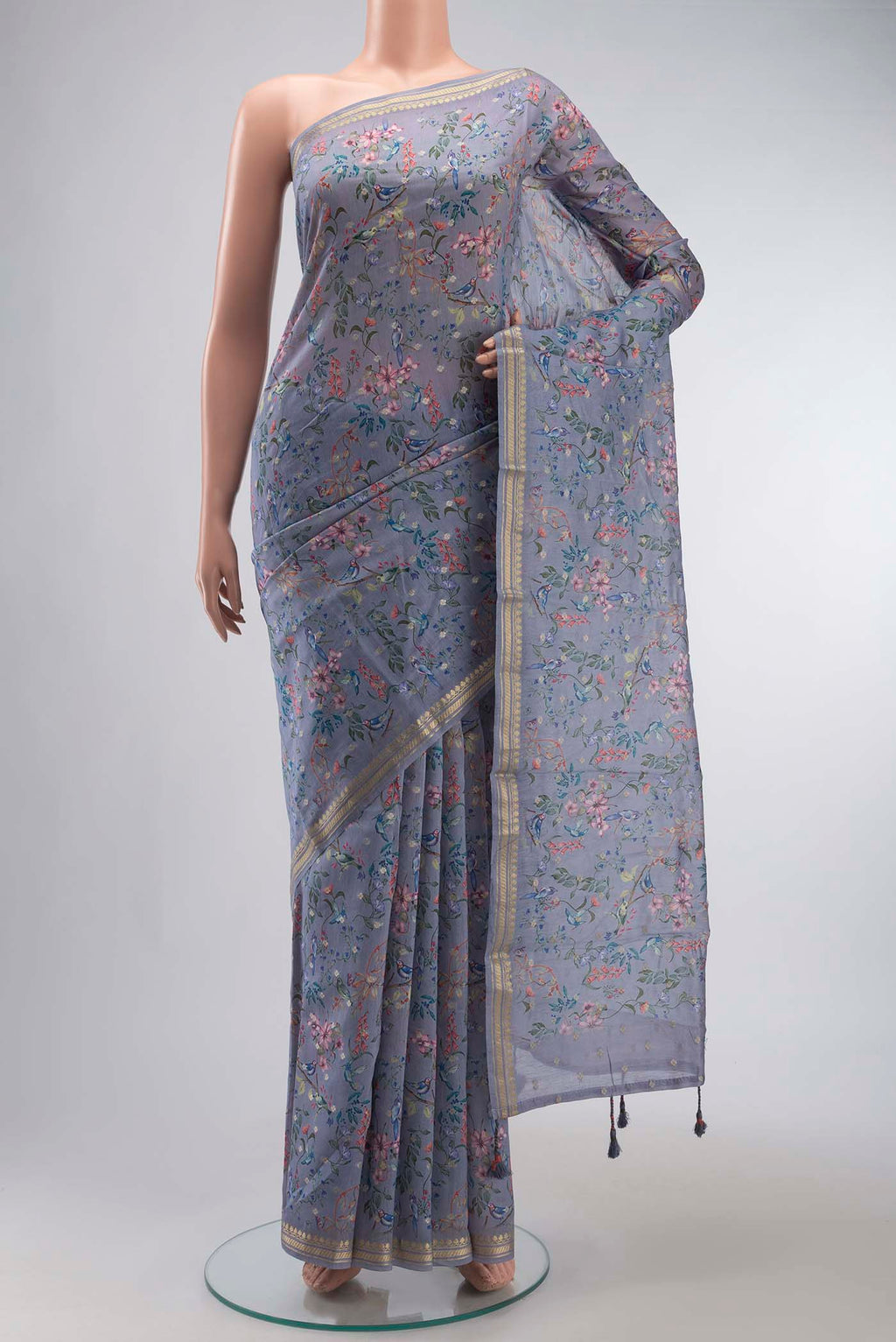 Blue Silk Cotton Saree with Printed design on the body and Zari Border displayed on a mannequin