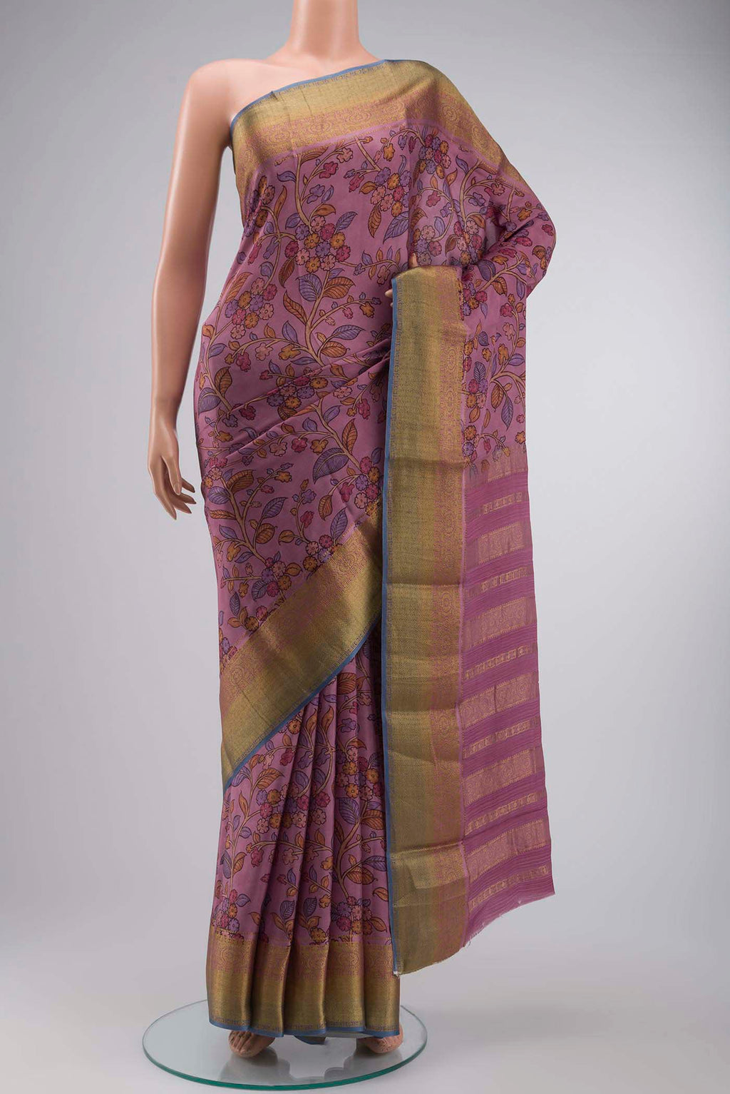Mauve Mysore Crepe Saree with Printed design on the body and Zari Border displayed on a mannequin