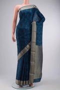 Blue Mysore Crepe Saree with Printed design on the body and Zari Border displayed on a mannequin