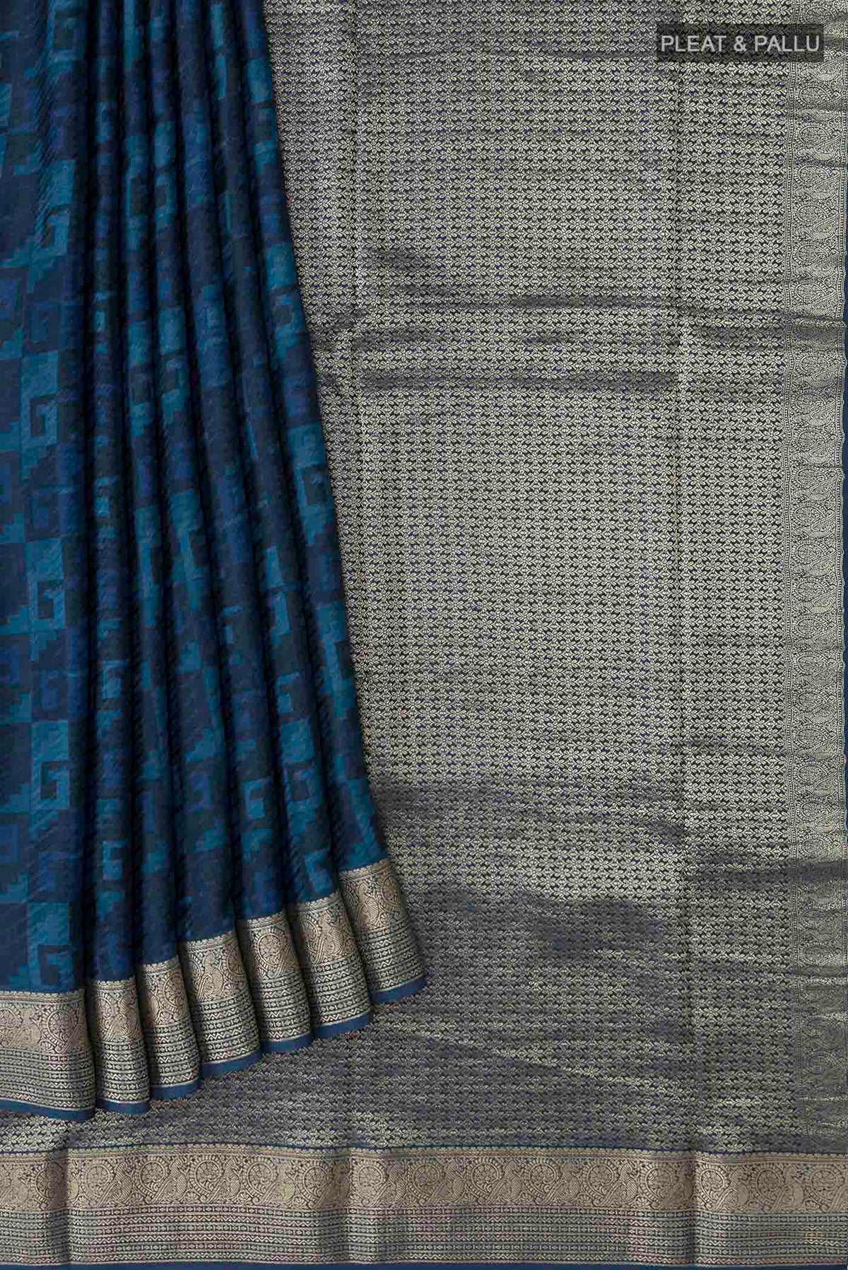 Pleats and pallu of Blue Mysore Crepe Saree with Printed design on the body and Zari Border