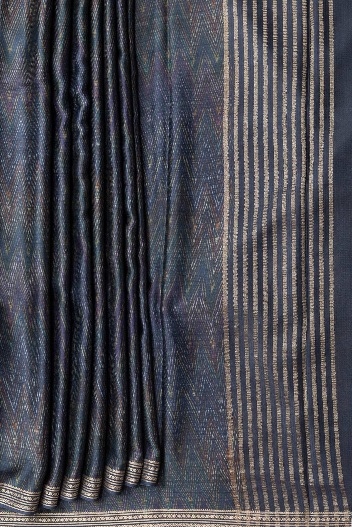 Pleats and pallu of Navy Blue Dual Tone Crepe Saree with Printed design on the body and Zari Border. 