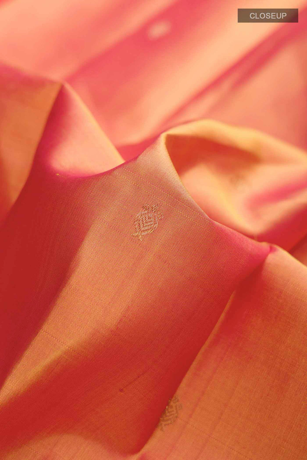 Close up of Mustard Kanchipuram Silk Saree with Zari Butta on the body and Plain Border displaying folds