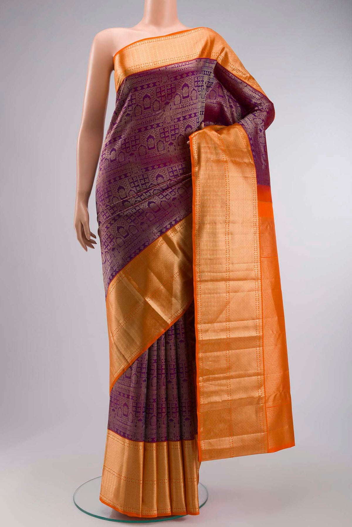 Violet Kanchipuram Silk Saree with Zari Brocade on the body and Zari Border displayed on a mannequin