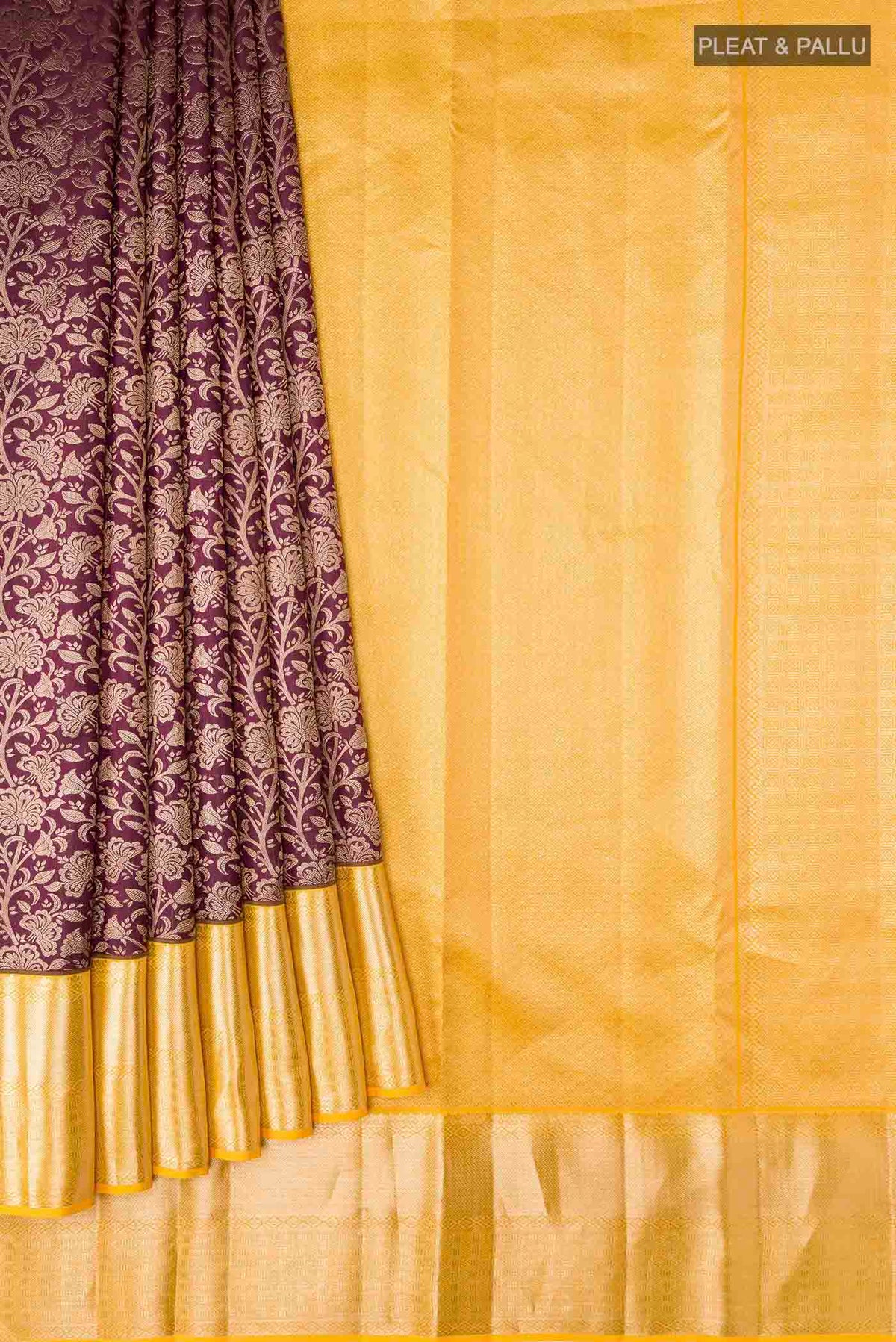 Pleats and pallu of Maroon Kanchipuram Silk Saree with Zari Brocade on the body and Zari Border