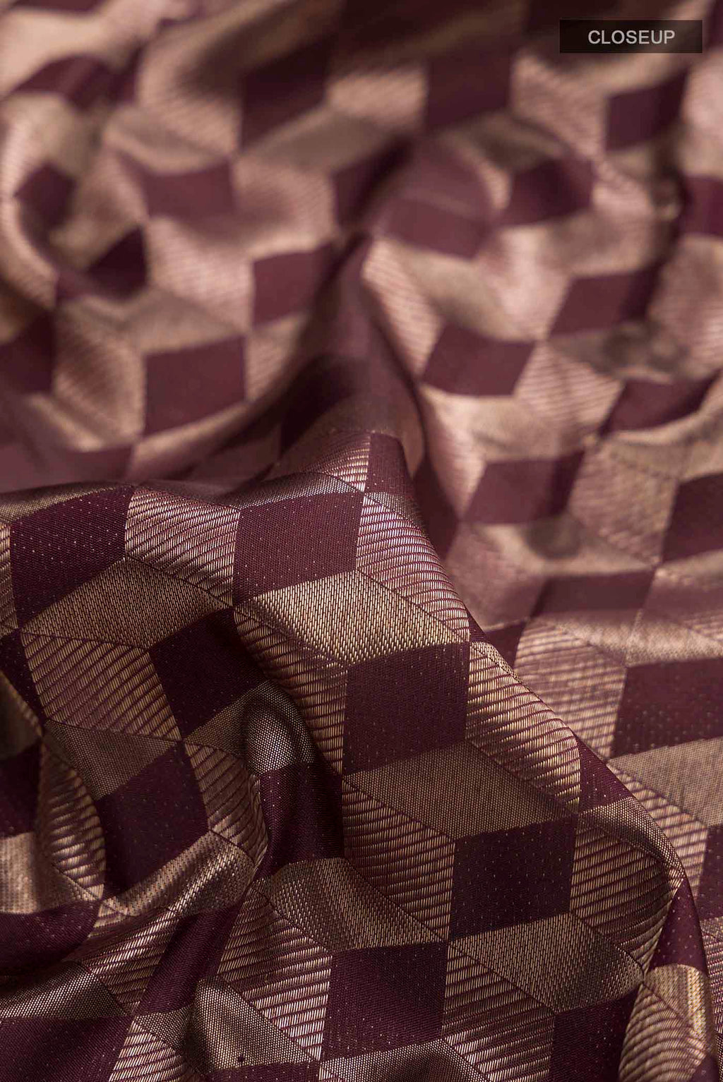 Close up of Brown Kanchipuram Silk Saree with Zari Brocade on the body and Zari Border displaying folds