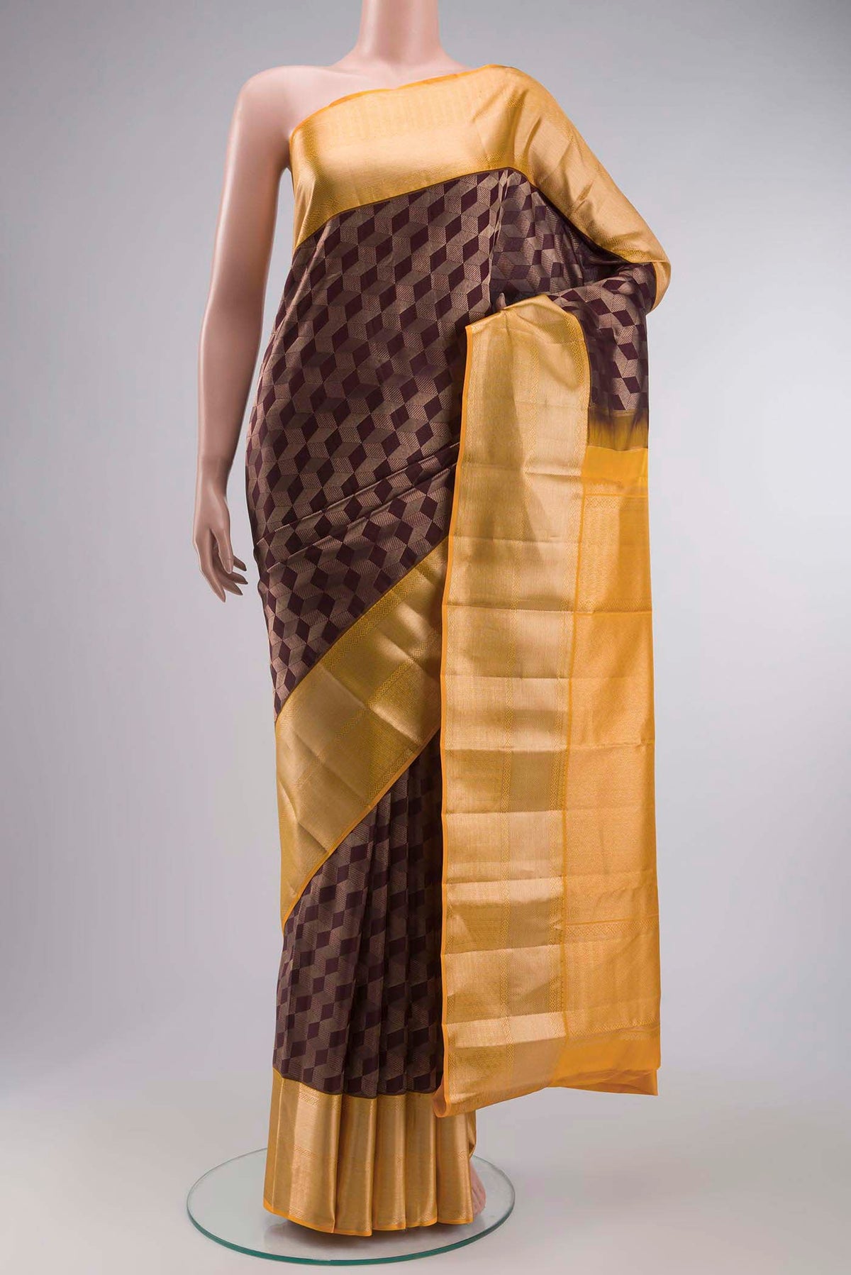 Brown Kanchipuram Silk Saree with Zari Brocade on the body and Zari Border displayed on a mannequin