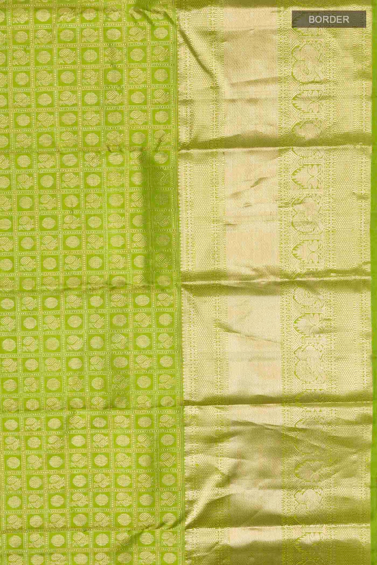 Border image of Green Kanchipuram Silk Saree with Zari Brocade on the body and Zari Border