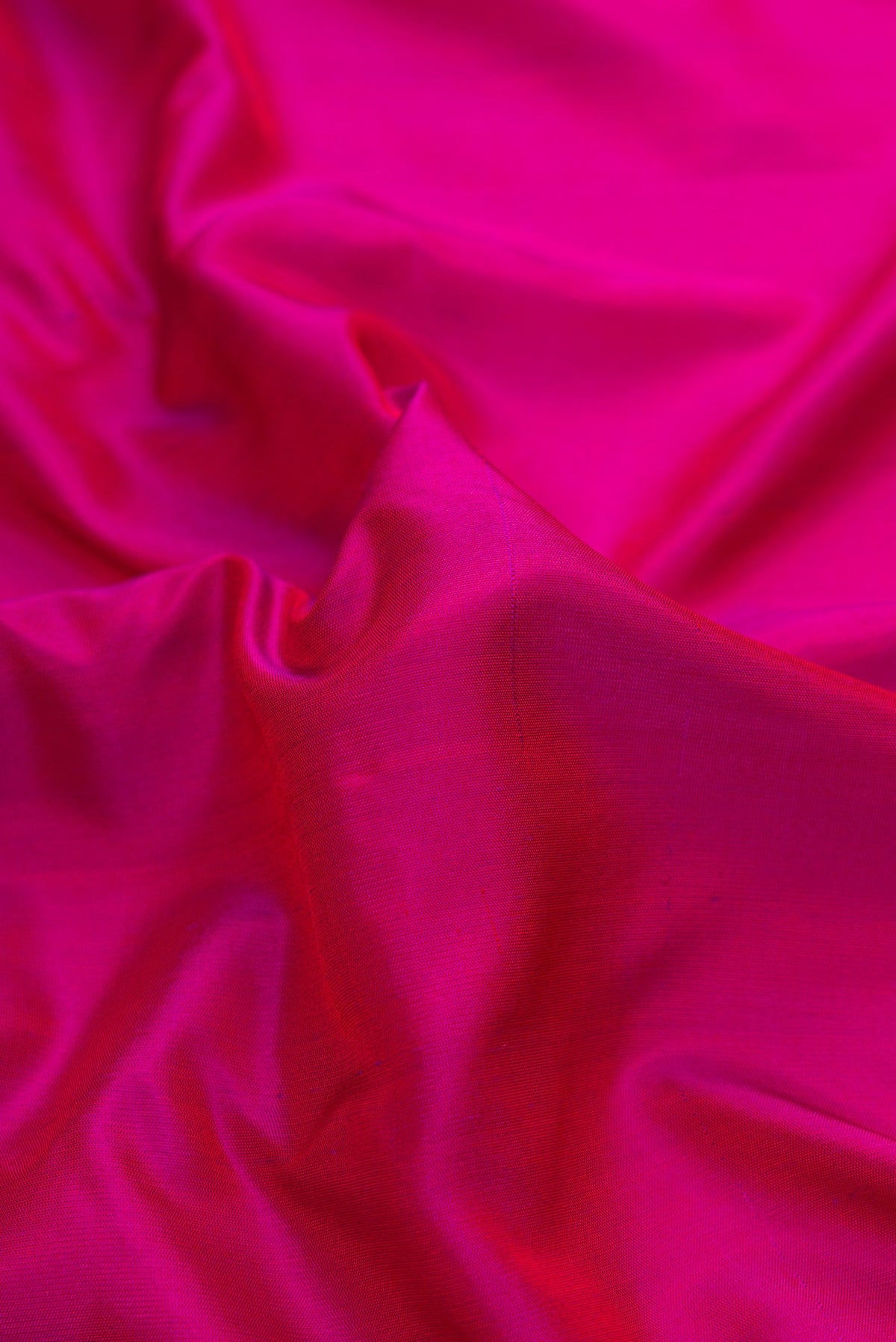 Close up of Pink Dual Tone Gadwal Silk Saree with Plain Body and Zari Border.  displaying folds