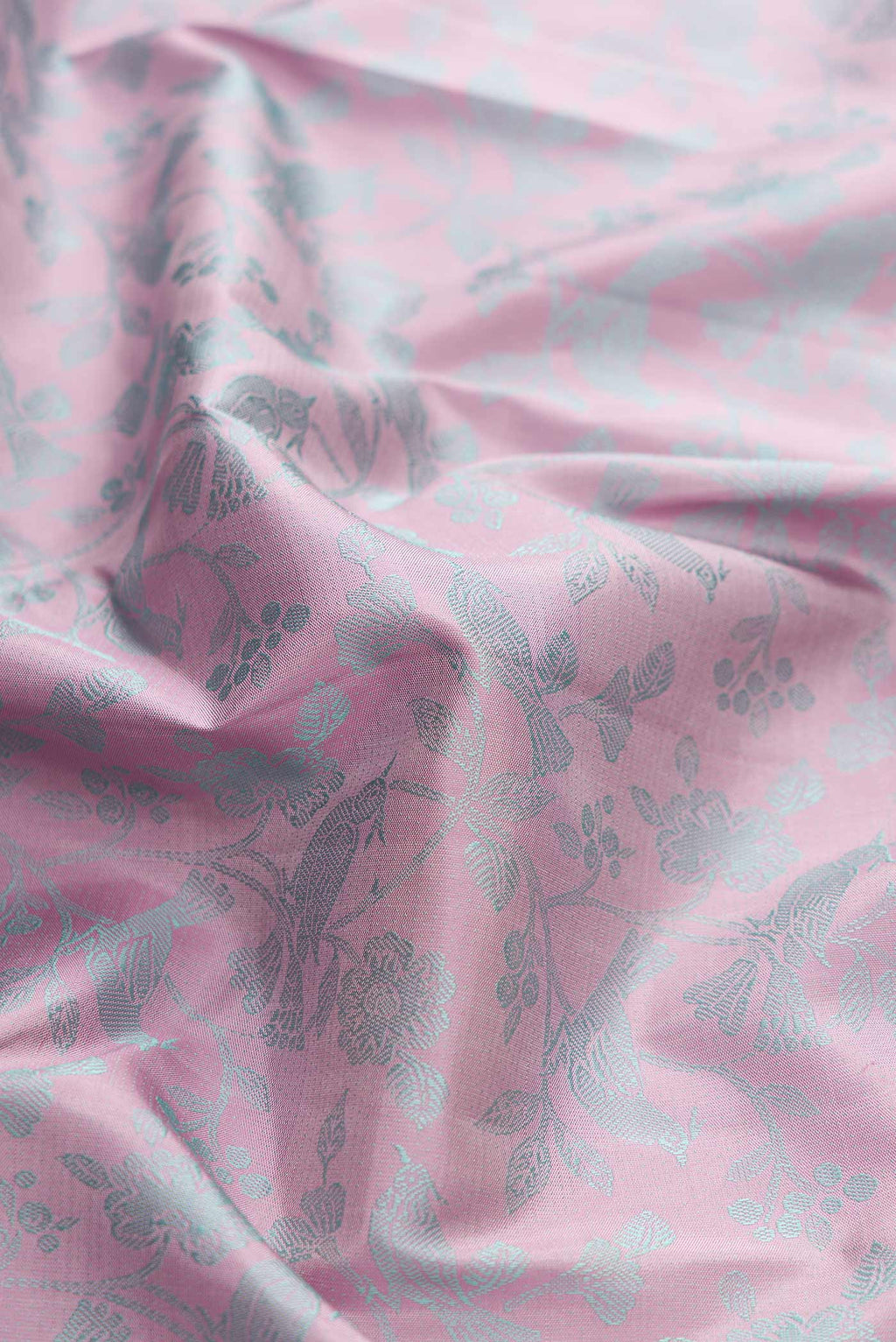 Close up of Pure Silk Pure Zari Pink Dual Tone Kanchipuram Saree with Jacquard design on the body and Fancy Border displaying folds
