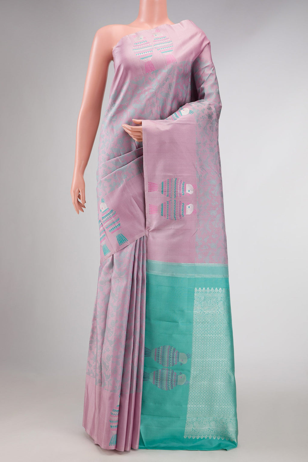Pure Silk Pure Zari Pink Dual Tone Kanchipuram Saree with Jacquard design on the body and Fancy Border displayed on a mannequin