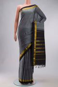 Grey Kanchipuram Silk Saree with Plain Body and Zari Border displayed on a mannequin