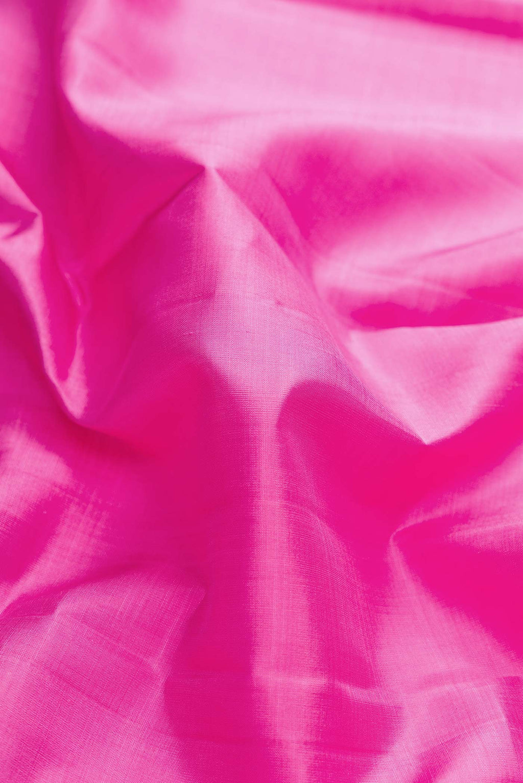 Close up of Pink Dual Tone Kanchipuram Silk Saree with Plain Body and Zari Border displaying folds