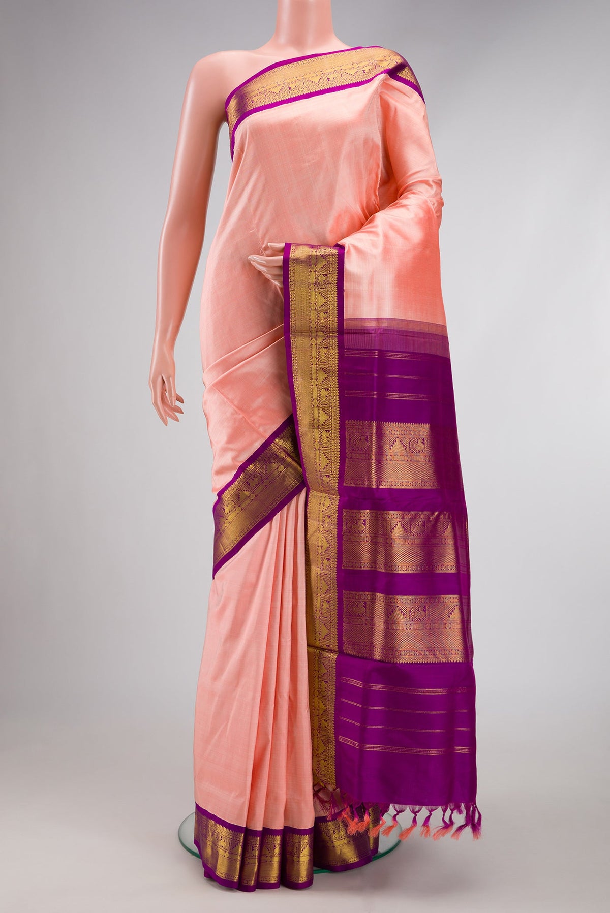 Pure Silk Pure Zari Golden Peach Kanchipuram Nine Yards Saree with Plain Body and Zari Border.  displayed on a mannequin