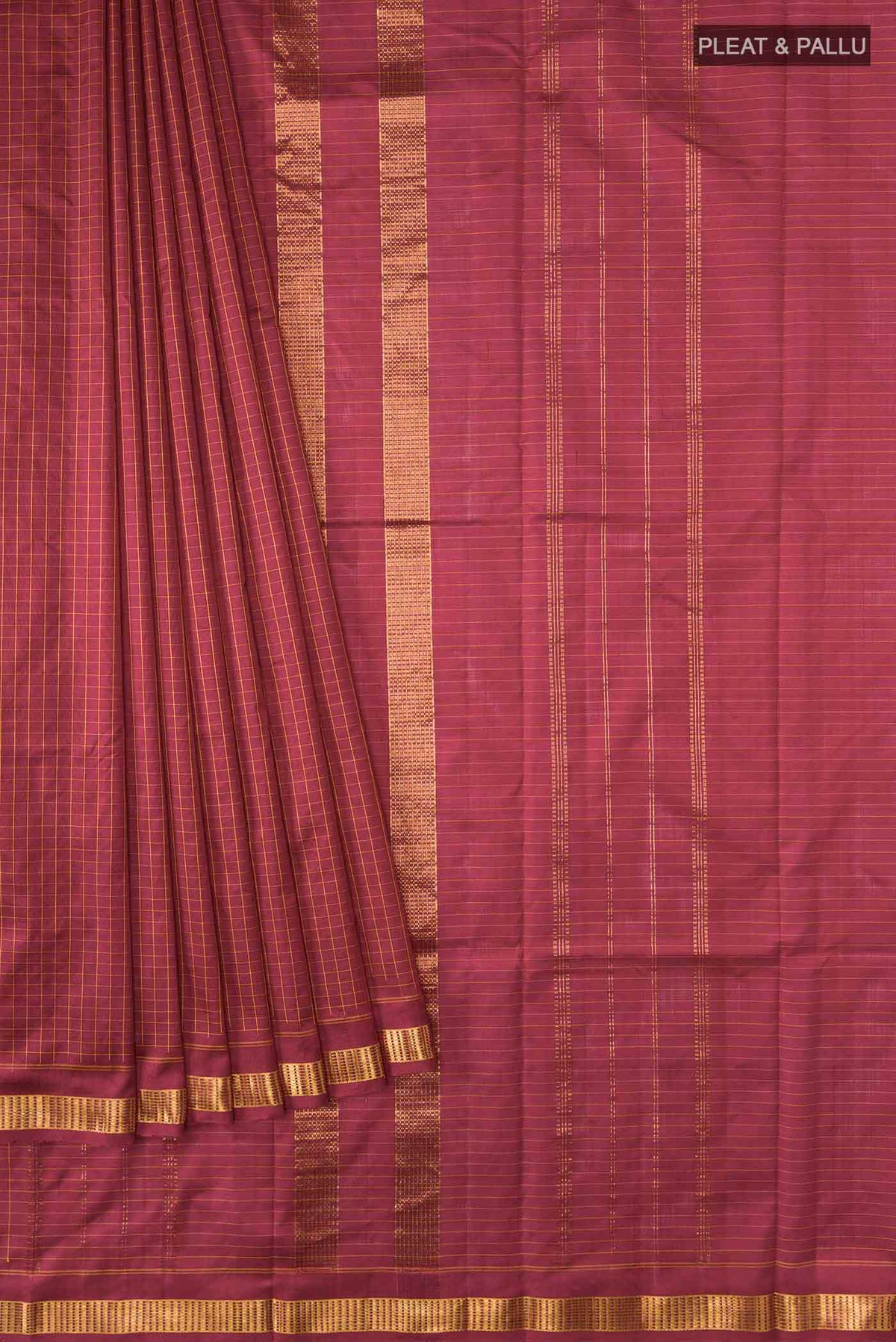 Pleats and pallu of Maroon Kanchipuram Silk Saree with Checked design on the body and Zari Border