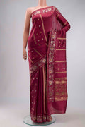 Magenta Banarasi Raw Silk Saree with Zari Butta on the body and Zari Border displayed on a mannequin