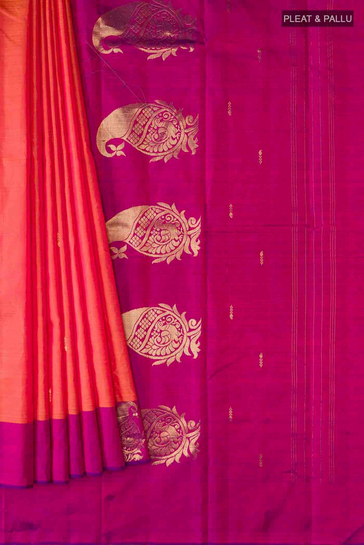 Pleats and pallu of Orange Kanchipuram Silk Saree with Zari Butta on the body and Zari Border