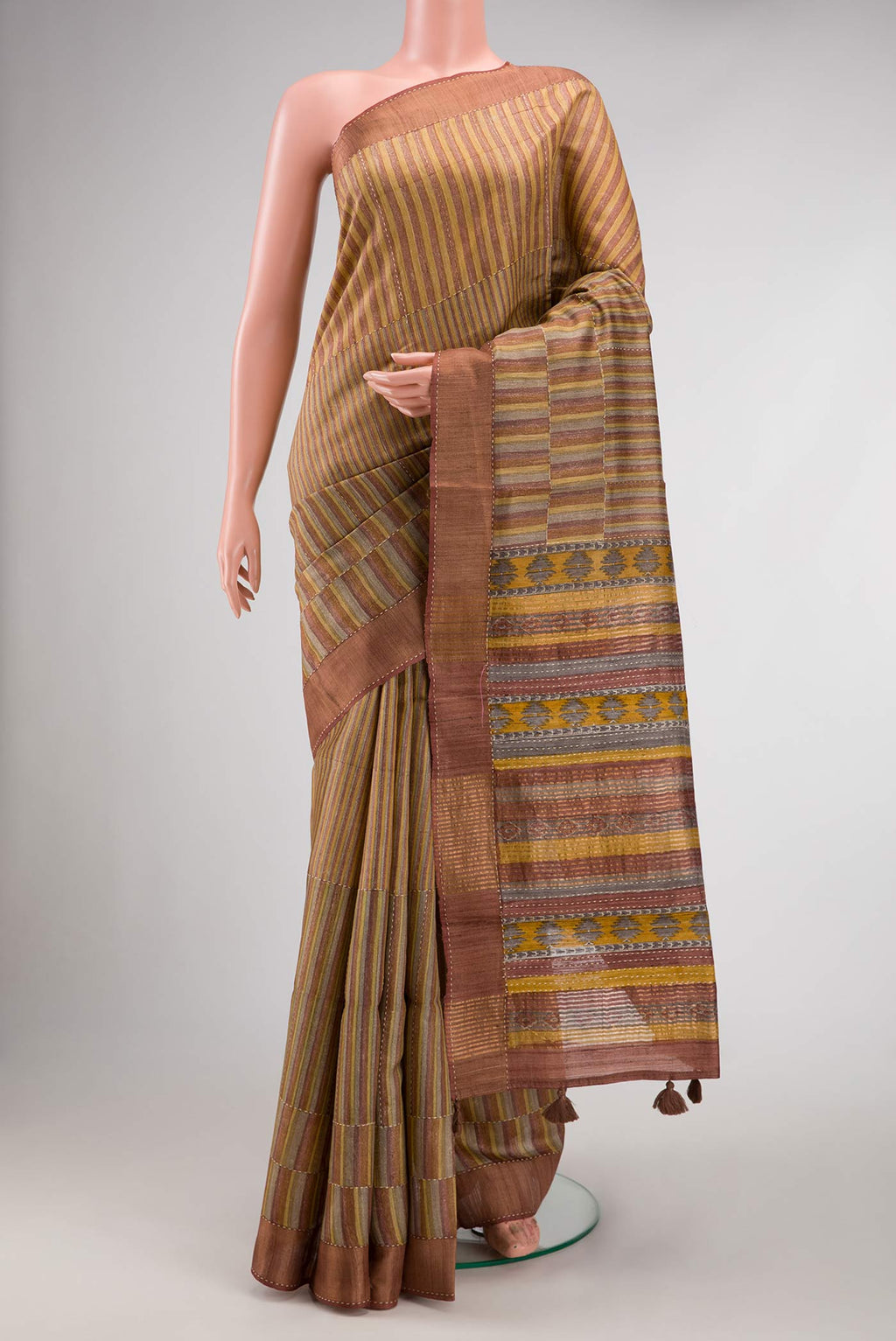 Mustard Dual Tone Tussar Silk Saree with Stripes on the body and Embroidery Border.  displayed on a mannequin