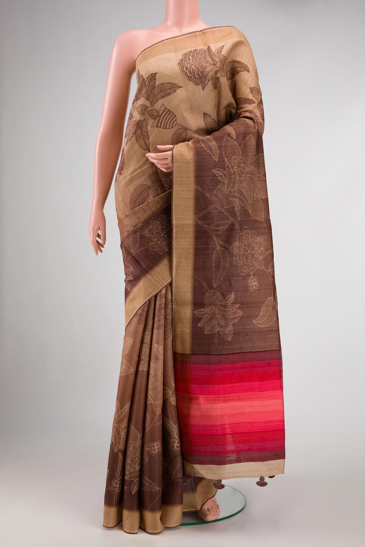 Brown Dual Tone Tussar Silk Saree with Printed design on the body and Embroidery Border.  displayed on a mannequin