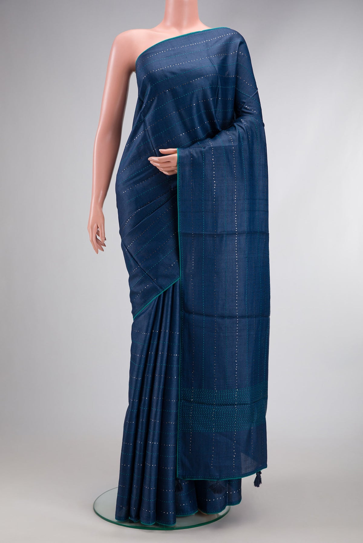 Navy Blue Dual Tone Tussar Silk Saree with Embroidery on the body and Embroidery Border.  displayed on a mannequin