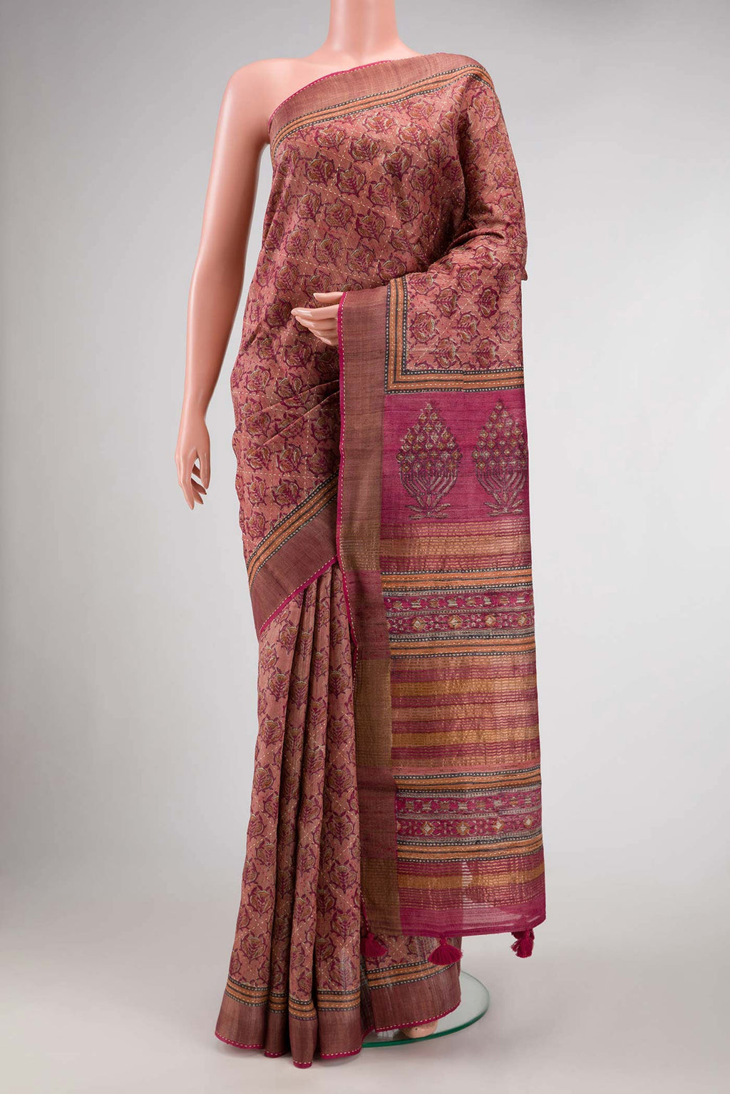Golden Peach Dual Tone Tussar Silk Saree with Printed design on the body and Embroidery Border.  displayed on a mannequin