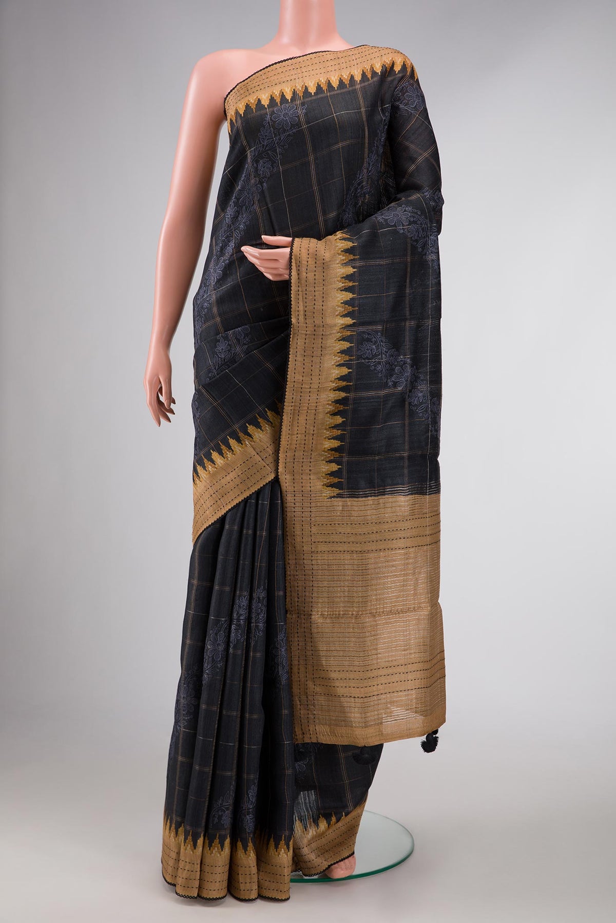 Black Dual Tone Tussar Silk Saree with Checked design on the body and Zari Border displayed on a mannequin