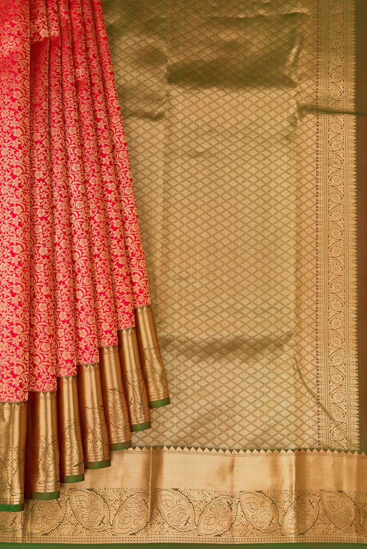 Pleats and pallu of Red Kanchipuram Silk Saree with Zari Brocade on the body and Zari Border. 
