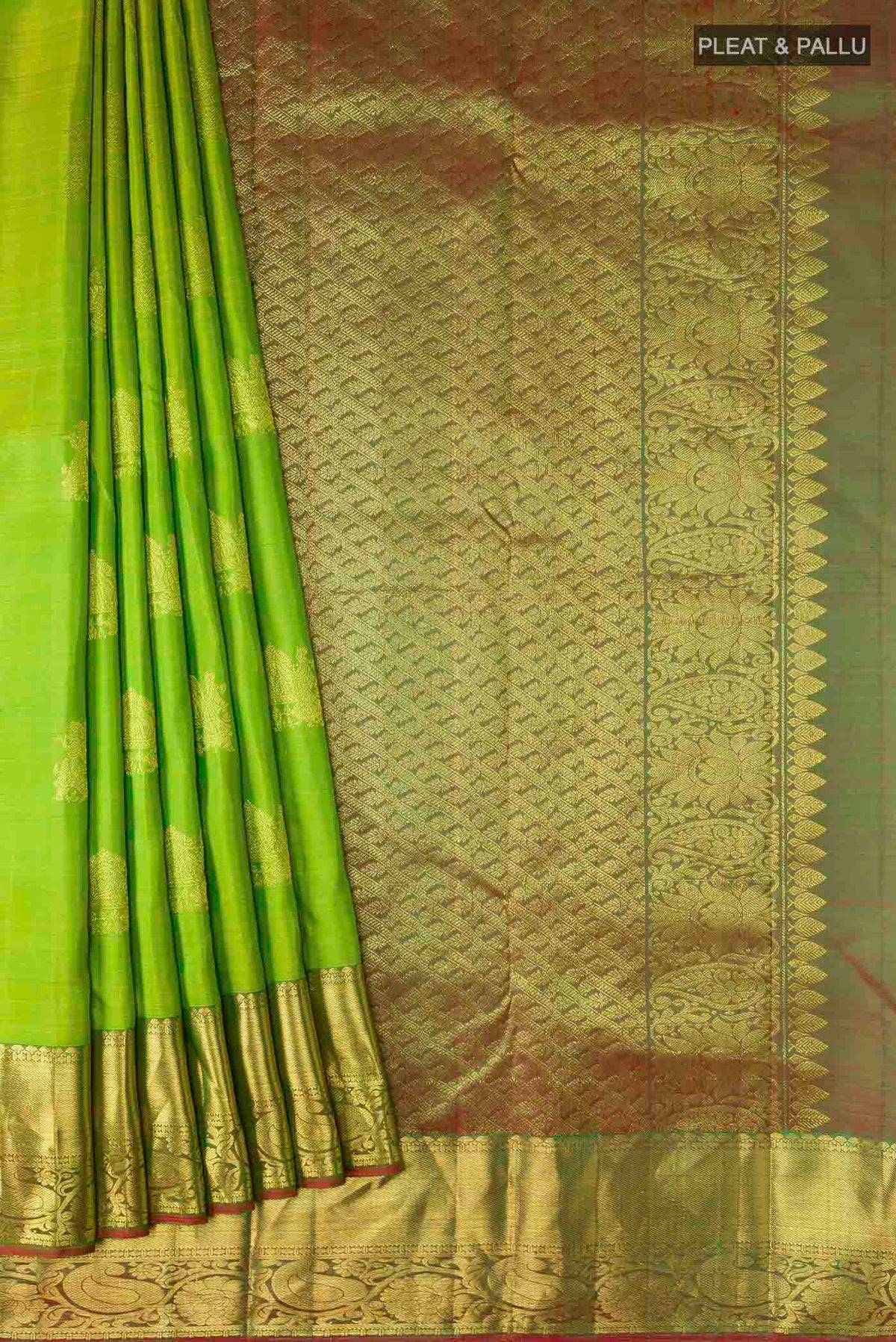 Pleats and pallu of Green Kanchipuram Silk Saree with Zari Butta on the body and Zari Border