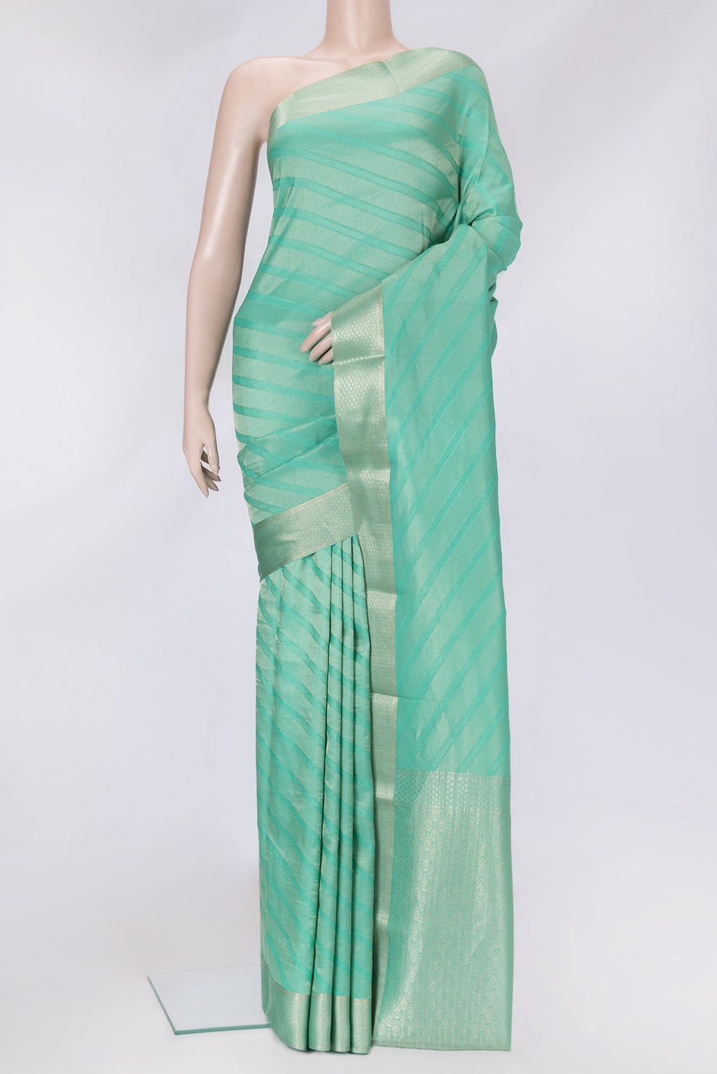 Sea Green Dual Tone Tussar Silk Saree with Zari Brocade on the body and Zari Border.  displayed on a mannequin