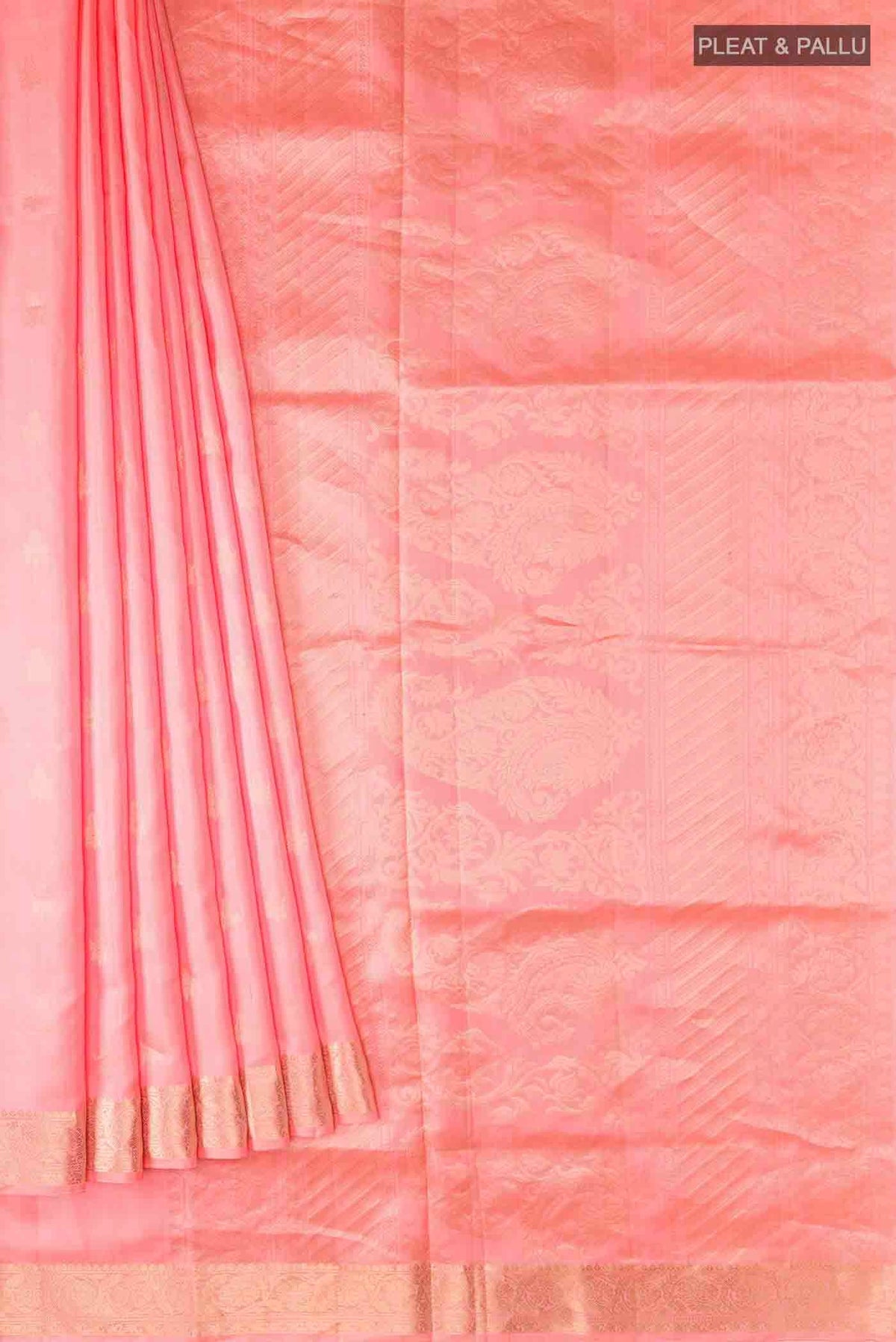 Pleats and pallu of Coral Soft Silk Saree with Zari Butta on the body and Zari Border