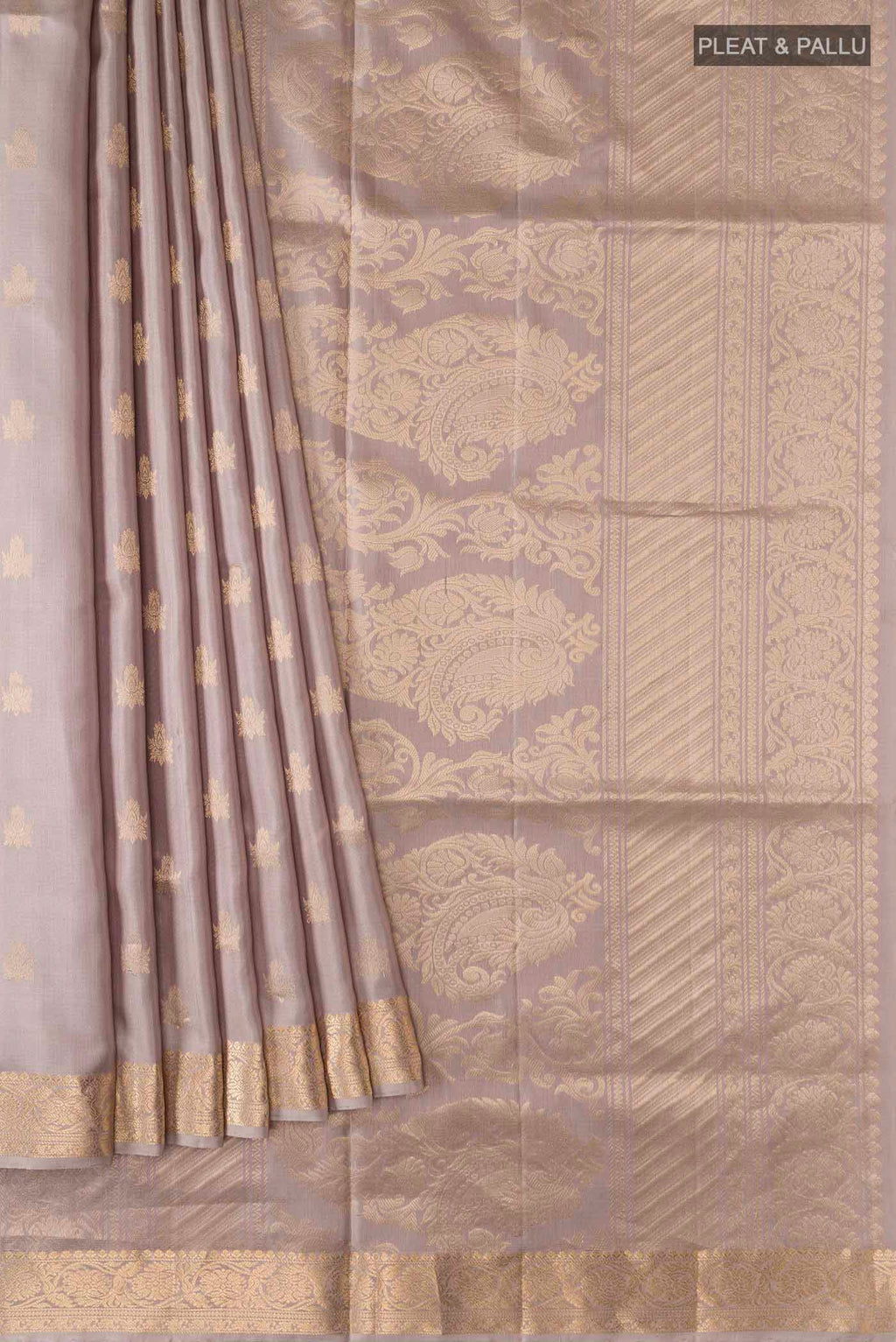 Pleats and pallu of Grey Soft Silk Saree with Zari Butta on the body and Zari Border