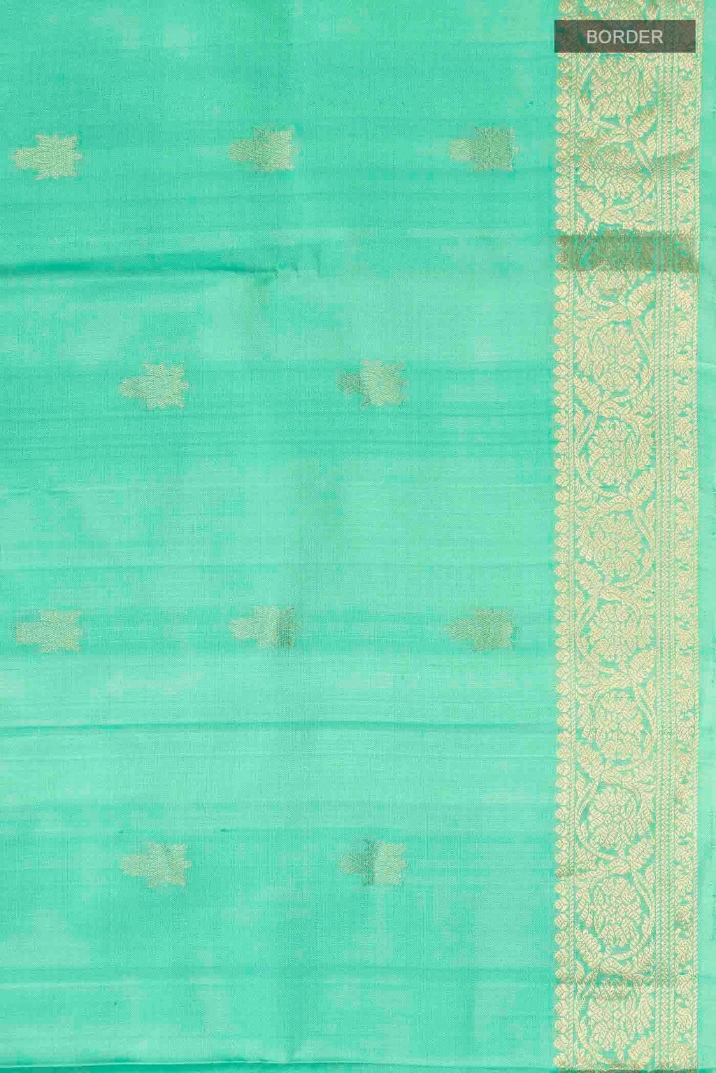 Border image of Green Soft Silk Saree with Zari Butta on the body and Zari Border