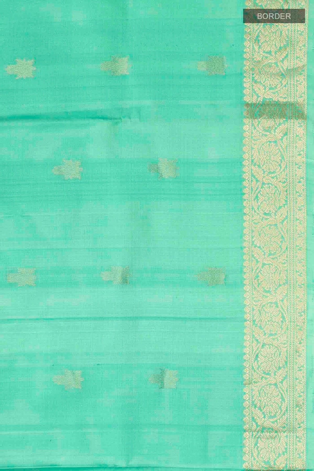 Border image of Green Soft Silk Saree with Zari Butta on the body and Zari Border