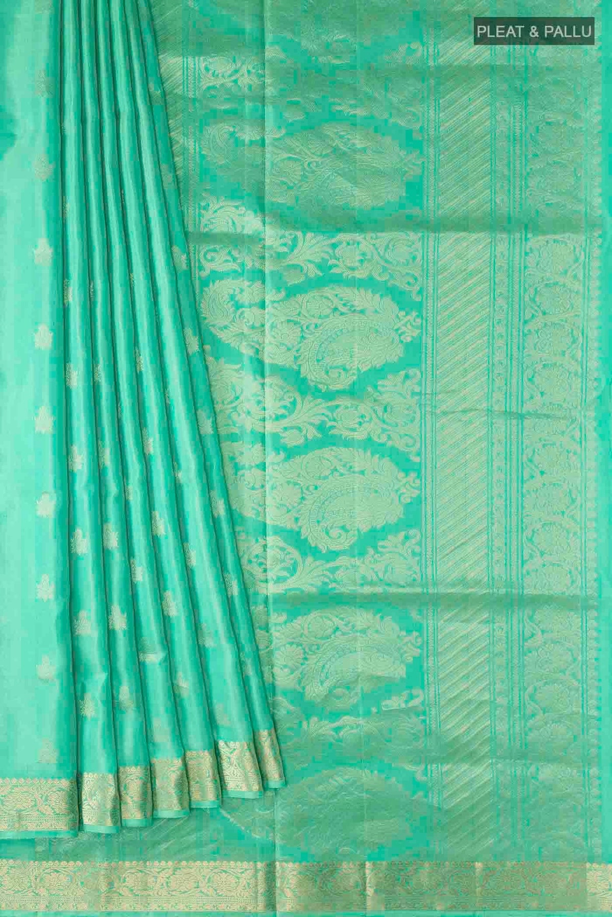 Pleats and pallu of Green Soft Silk Saree with Zari Butta on the body and Zari Border