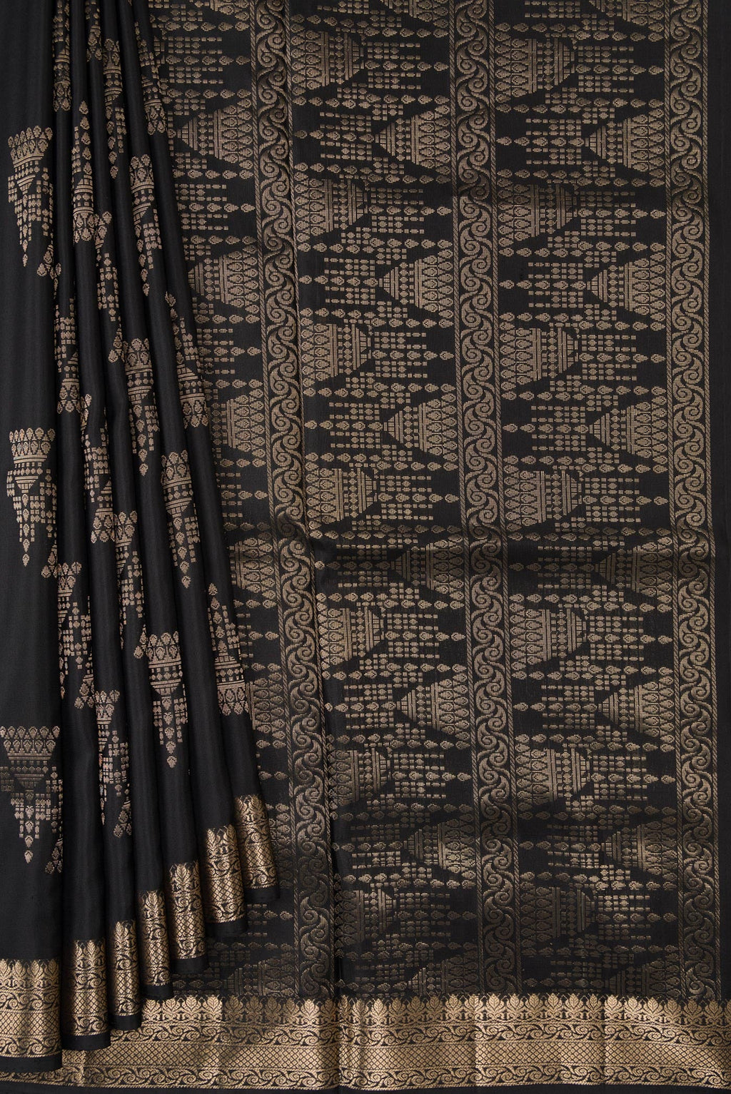 Pleats and pallu of Black Dual Tone Soft Silk Saree with Zari Butta on the body and Zari Border. 