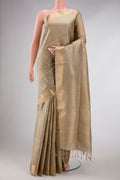 Beige Dual Tone Soft Silk Saree with Zari Butta on the body and Zari Border displayed on a mannequin