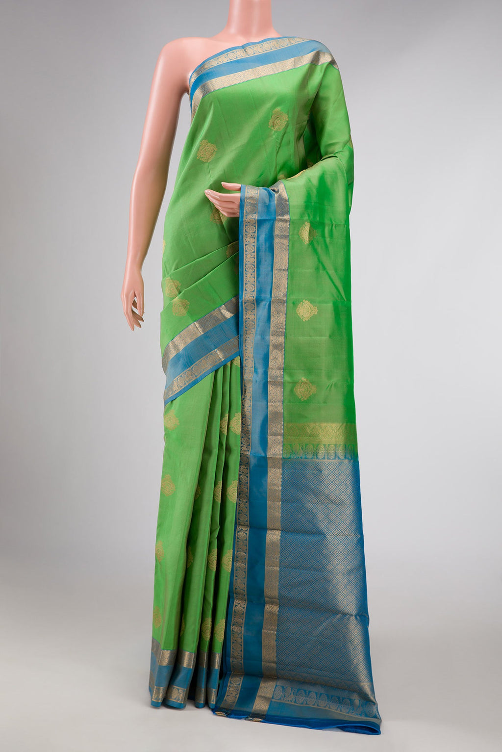 Parrot Green Dual Tone Kanchipuram Silk Saree with Zari Butta on the body and Zari Border displayed on a mannequin