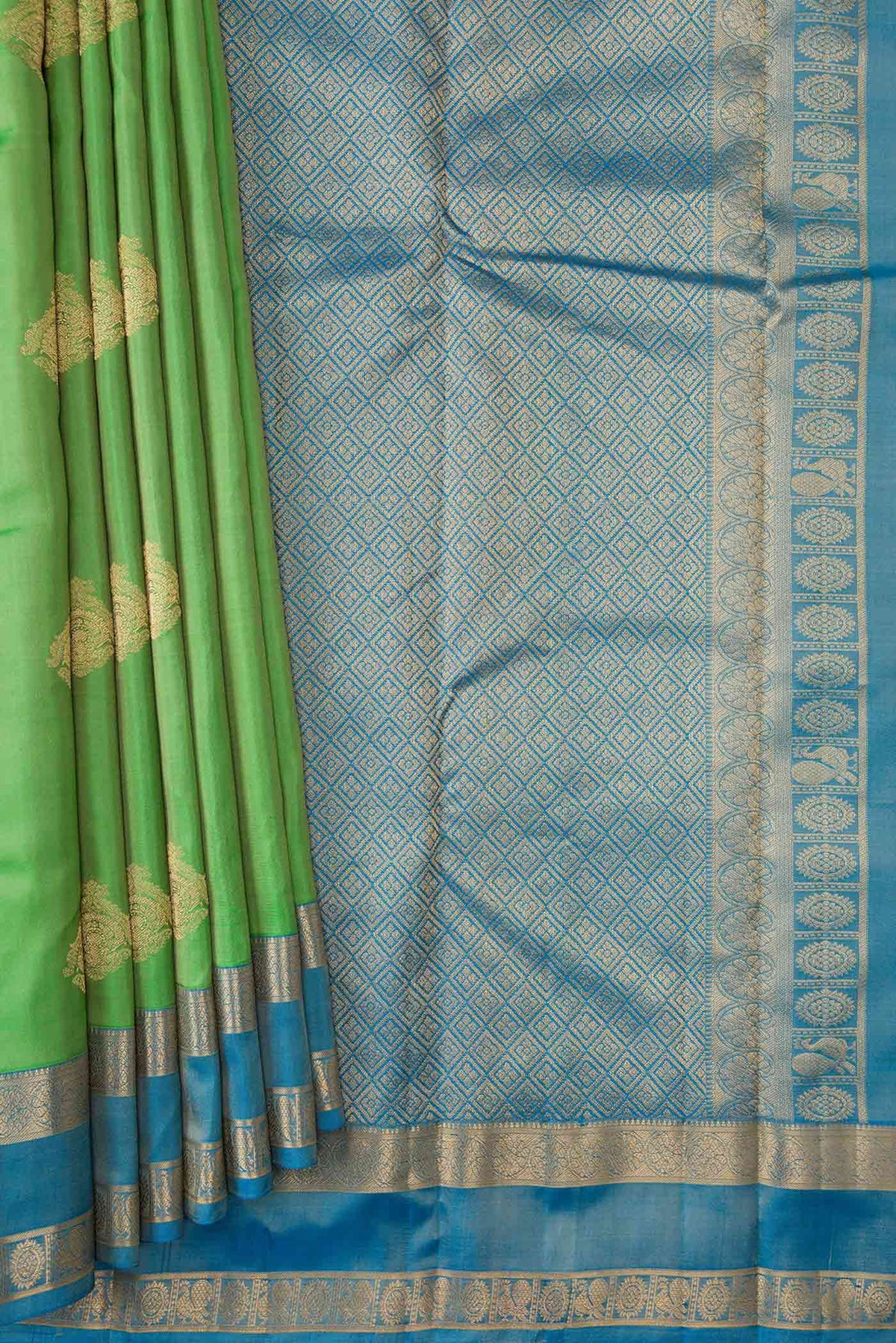 Pleats and pallu of Parrot Green Dual Tone Kanchipuram Silk Saree with Zari Butta on the body and Zari Border