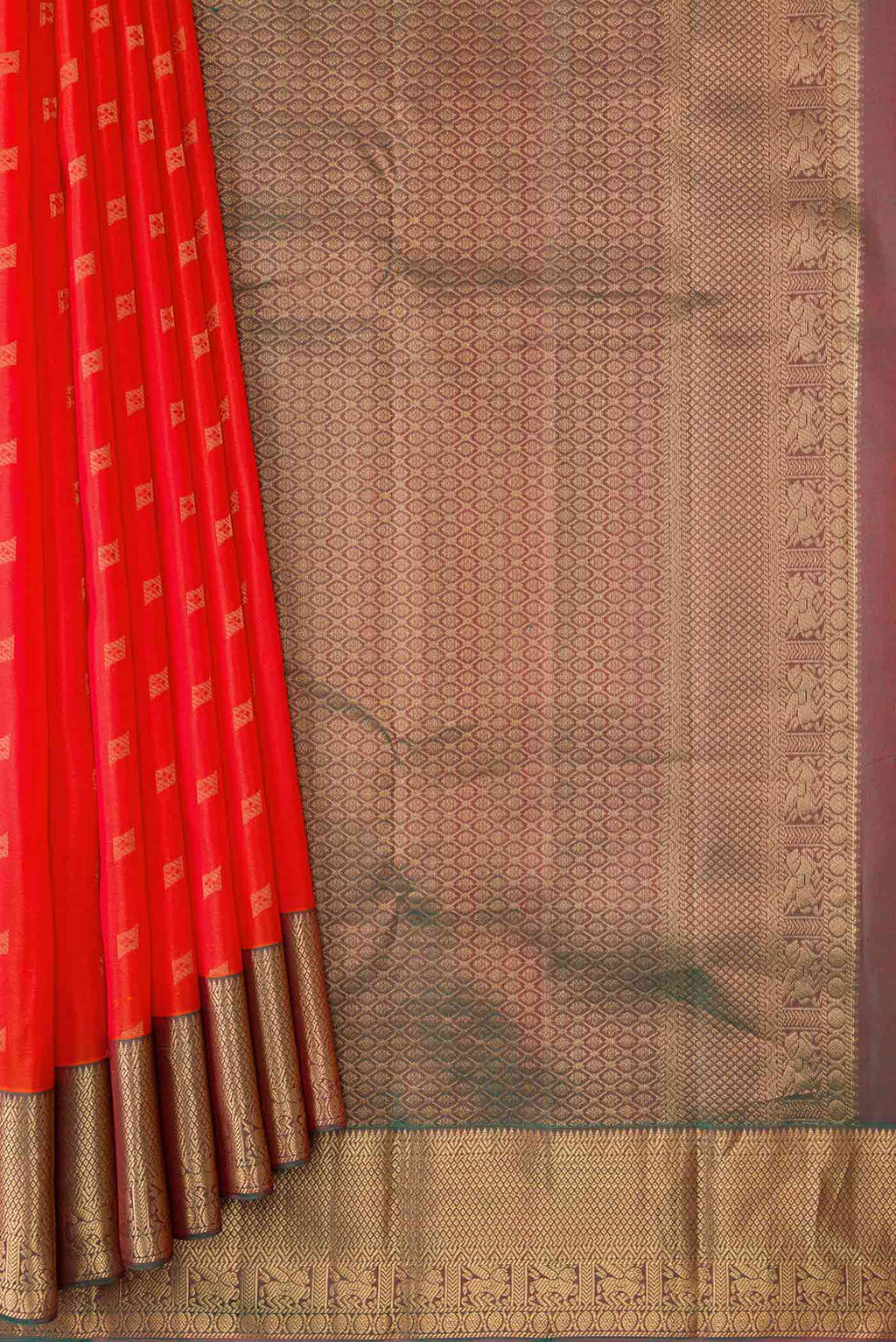 Pleats and pallu of Orange Dual Tone Kanchipuram Silk Saree with Zari Butta on the body and Zari Border
