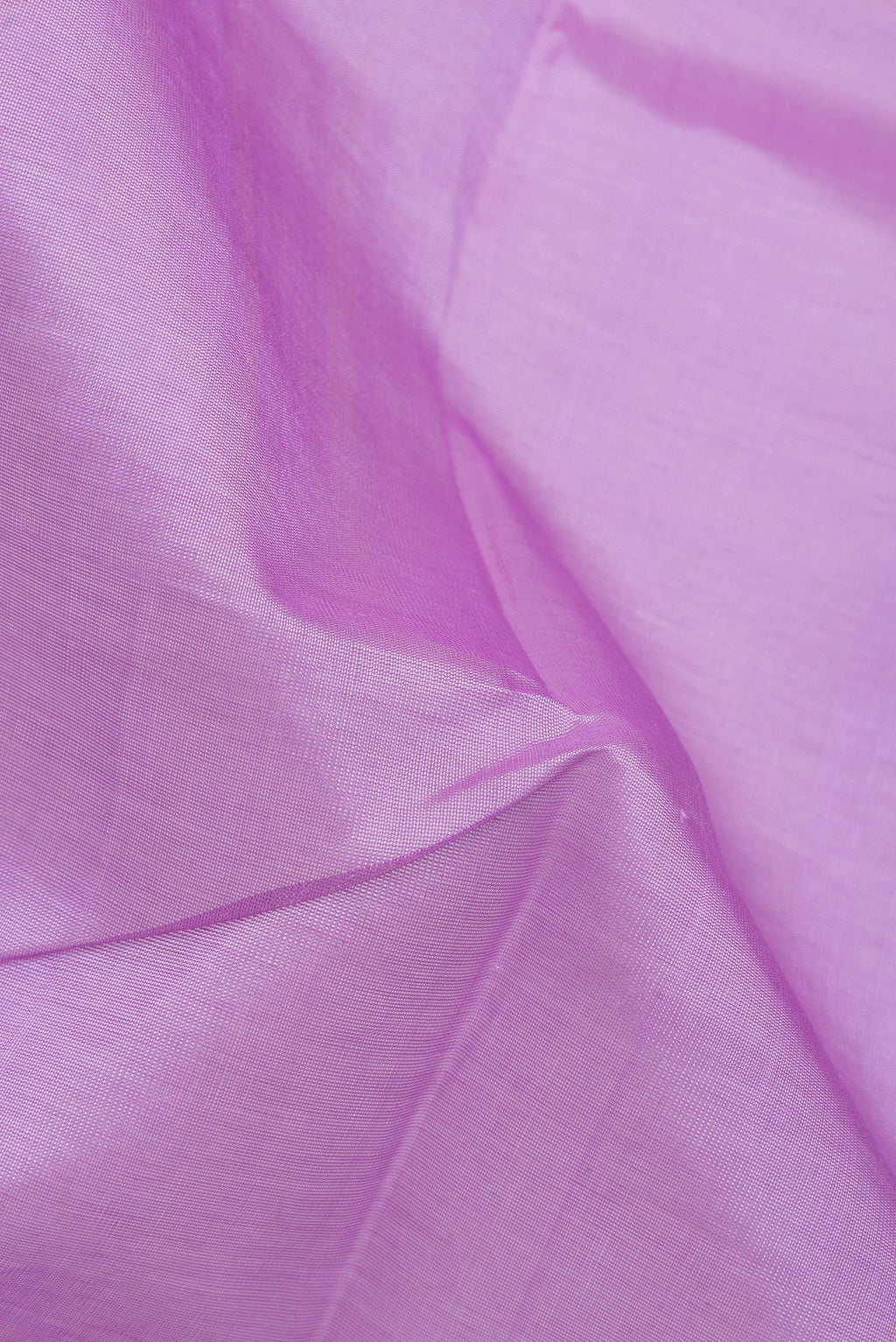 Close up of Lavender Silk Cotton Saree with Plain Body and Zari Border.  displaying folds