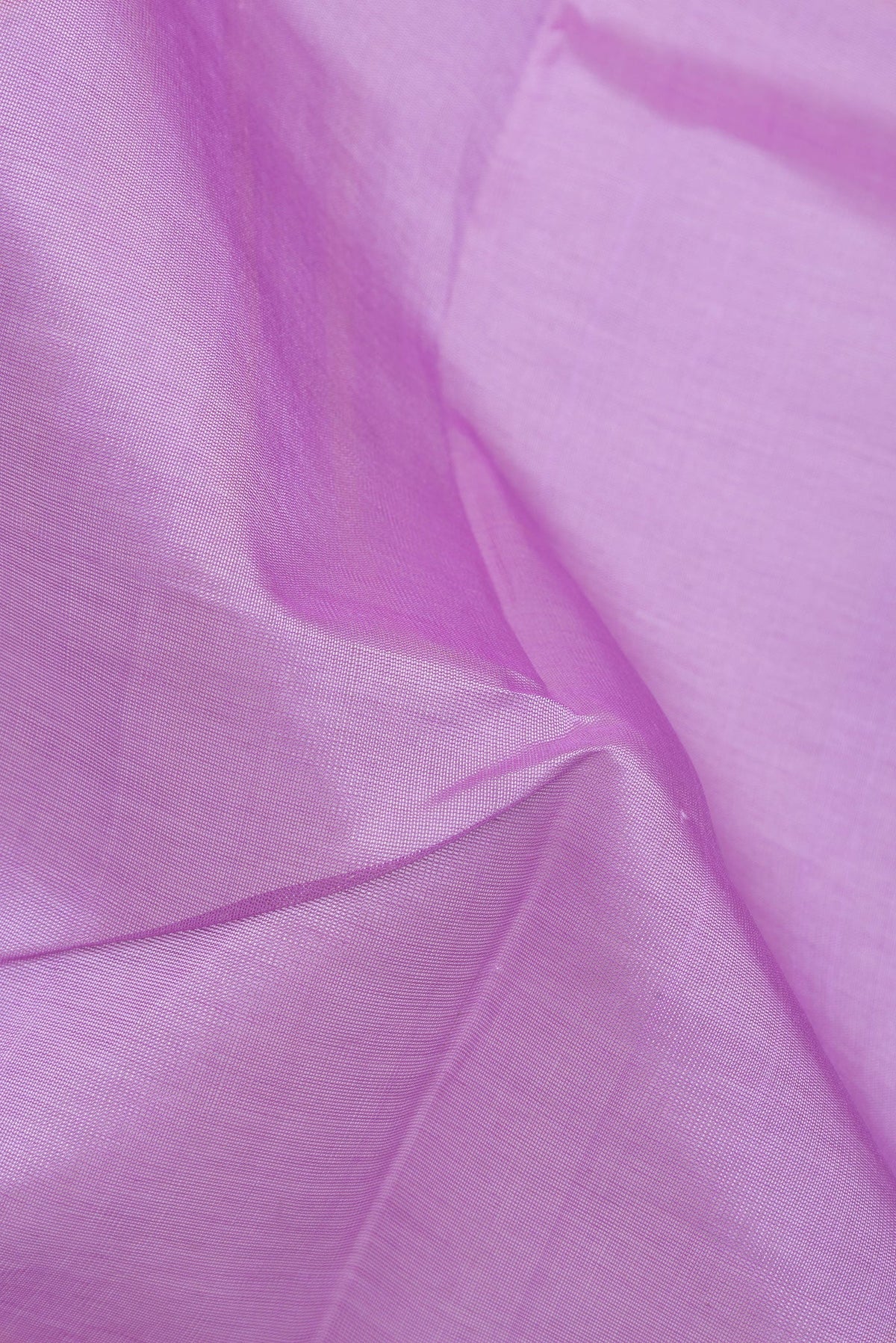 Close up of Lavender Silk Cotton Saree with Plain Body and Zari Border.  displaying folds