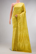 Yellow Printed Silk Saree with Printed design on the body and Printed Border.  displayed on a mannequin