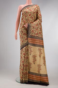 Beige Printed Silk Saree with Printed design on the body and Printed Border.  displayed on a mannequin