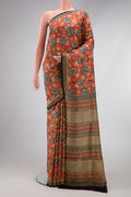 Orange Printed Silk Saree with Printed design on the body and Printed Border.  displayed on a mannequin