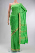 Green Printed Silk Saree with Printed design on the body and Zari Border displayed on a mannequin