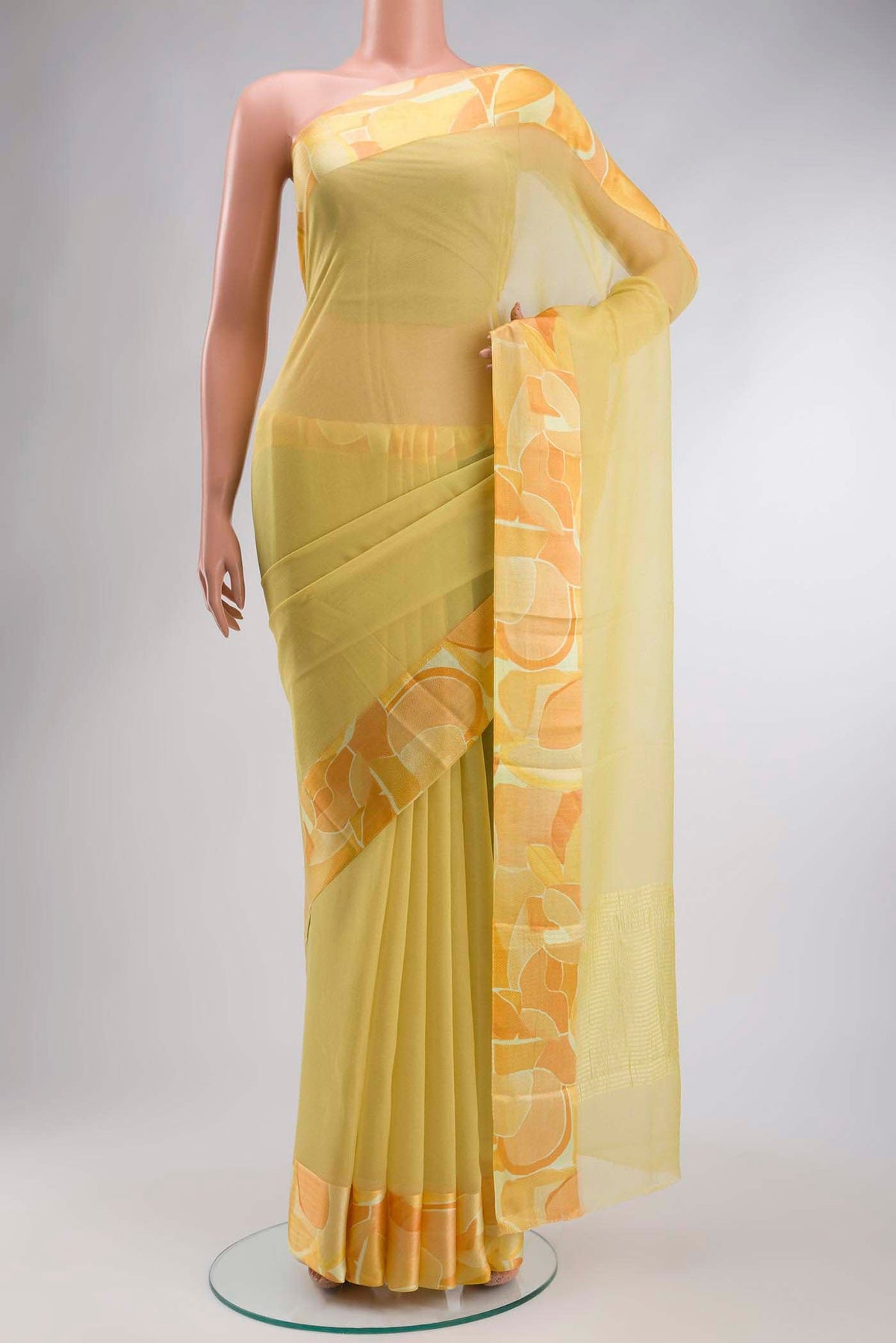 Yellow Mysore Chiffon Saree with Plain Body and Printed Border displayed on a mannequin