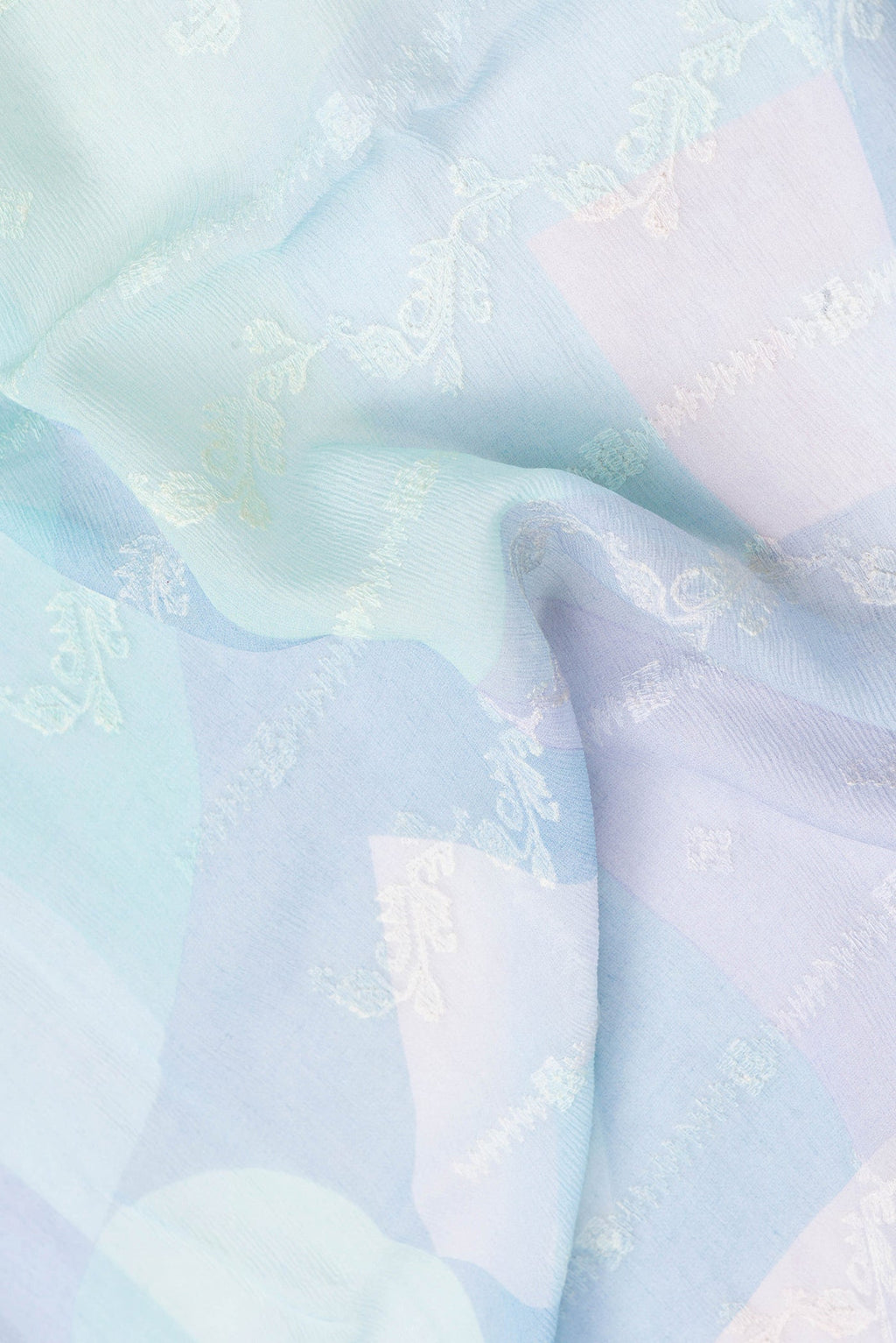 Close up of Multi Color Mysore Chiffon Saree with Embroidery on the body and Zari Border.  displaying folds