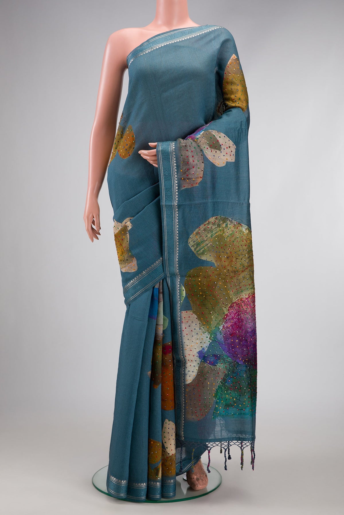 Blue Grey Dual Tone Tussar Silk Saree with Embroidery on the body and Zari And Thread Border.  displayed on a mannequin