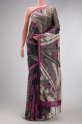 Grey Tussar Silk Saree with Embroidery on the body and Zari Border.  displayed on a mannequin